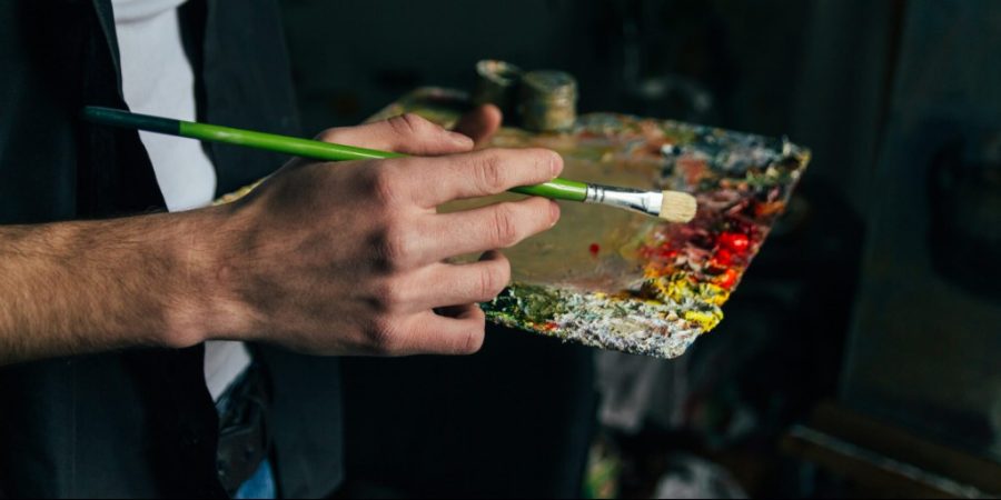 Best rehab for veterans man holding paint board and brush