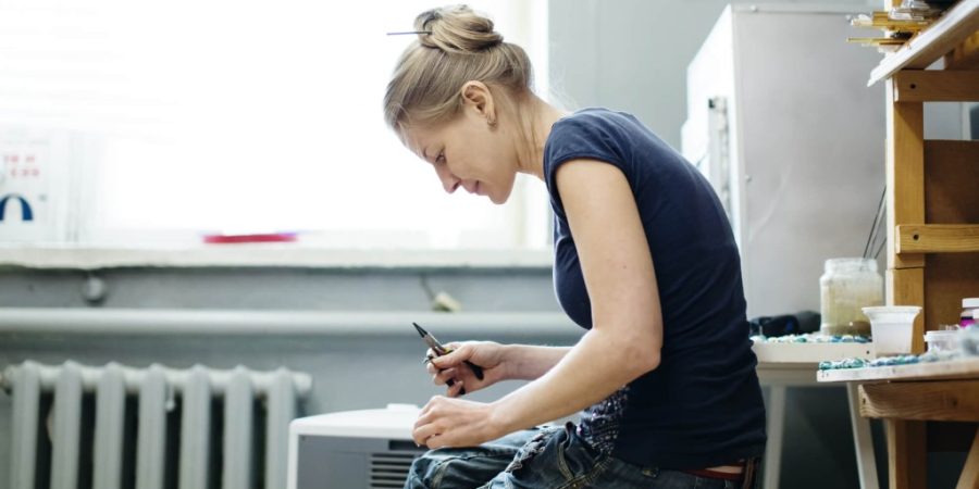 Woman painting in the Best rehab for veterans