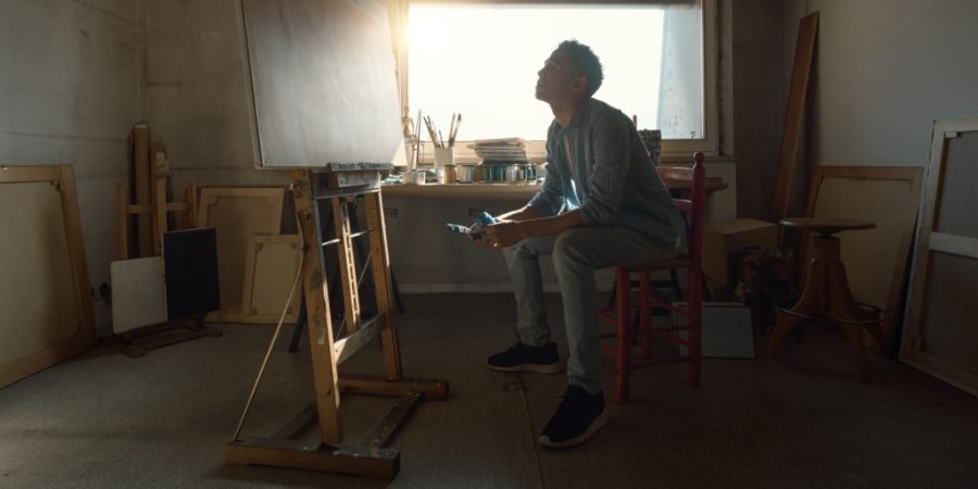 man looking at artwork at the Best rehab for veterans